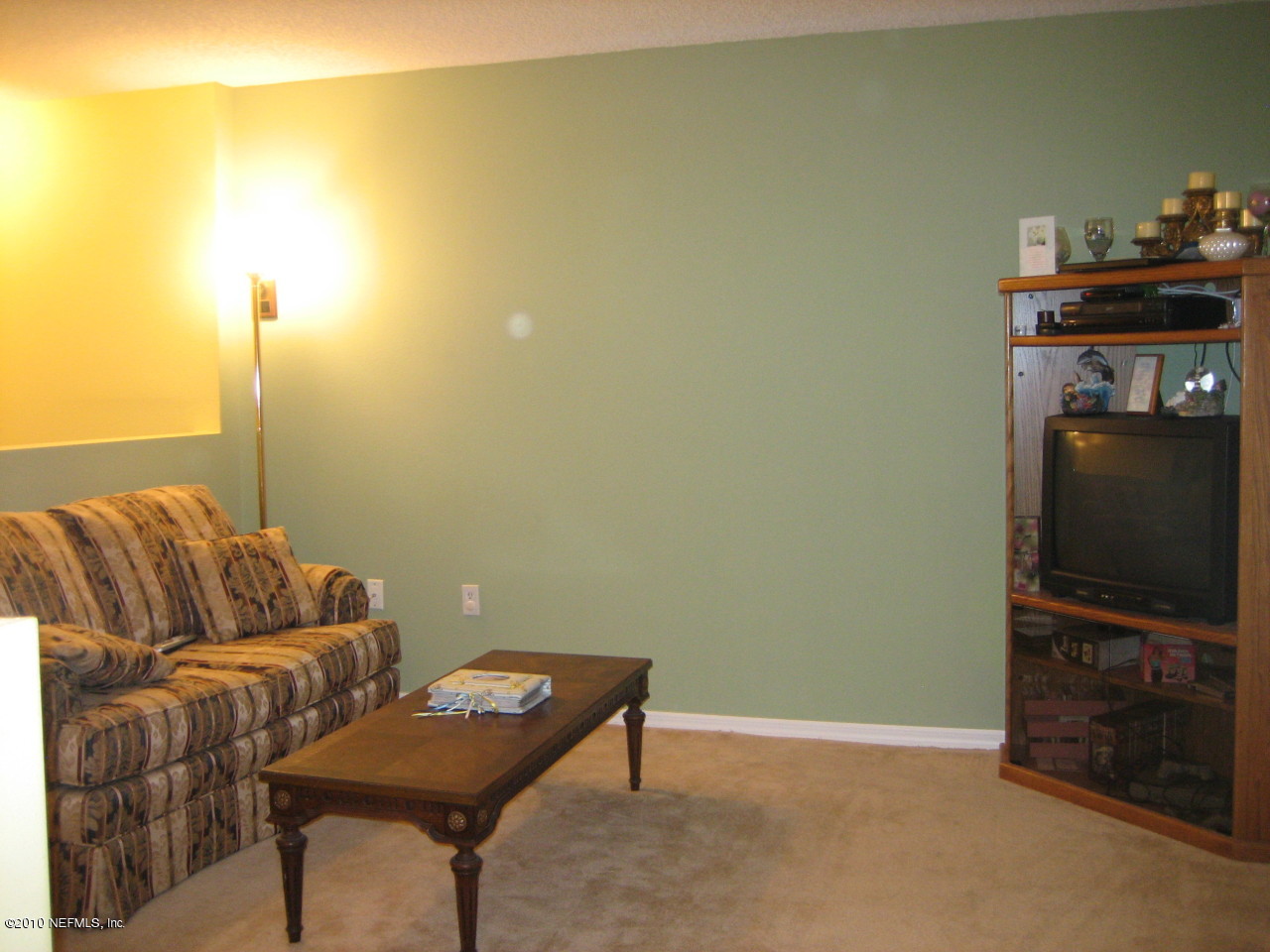 3411 Hickory Hammock Road Jacksonville, FL 32226 - Photo 9 of 14 a living room with furniture and a flat screen tv