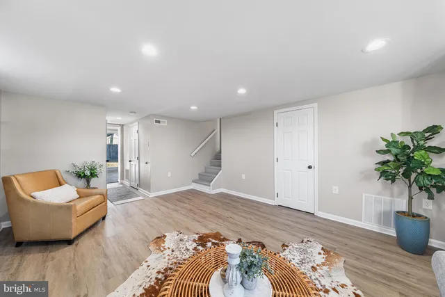 a bedroom with a bed and a potted plant