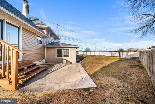 a view of a backyard of the house