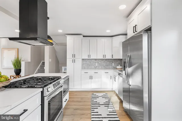a kitchen with a stove and a refrigerator