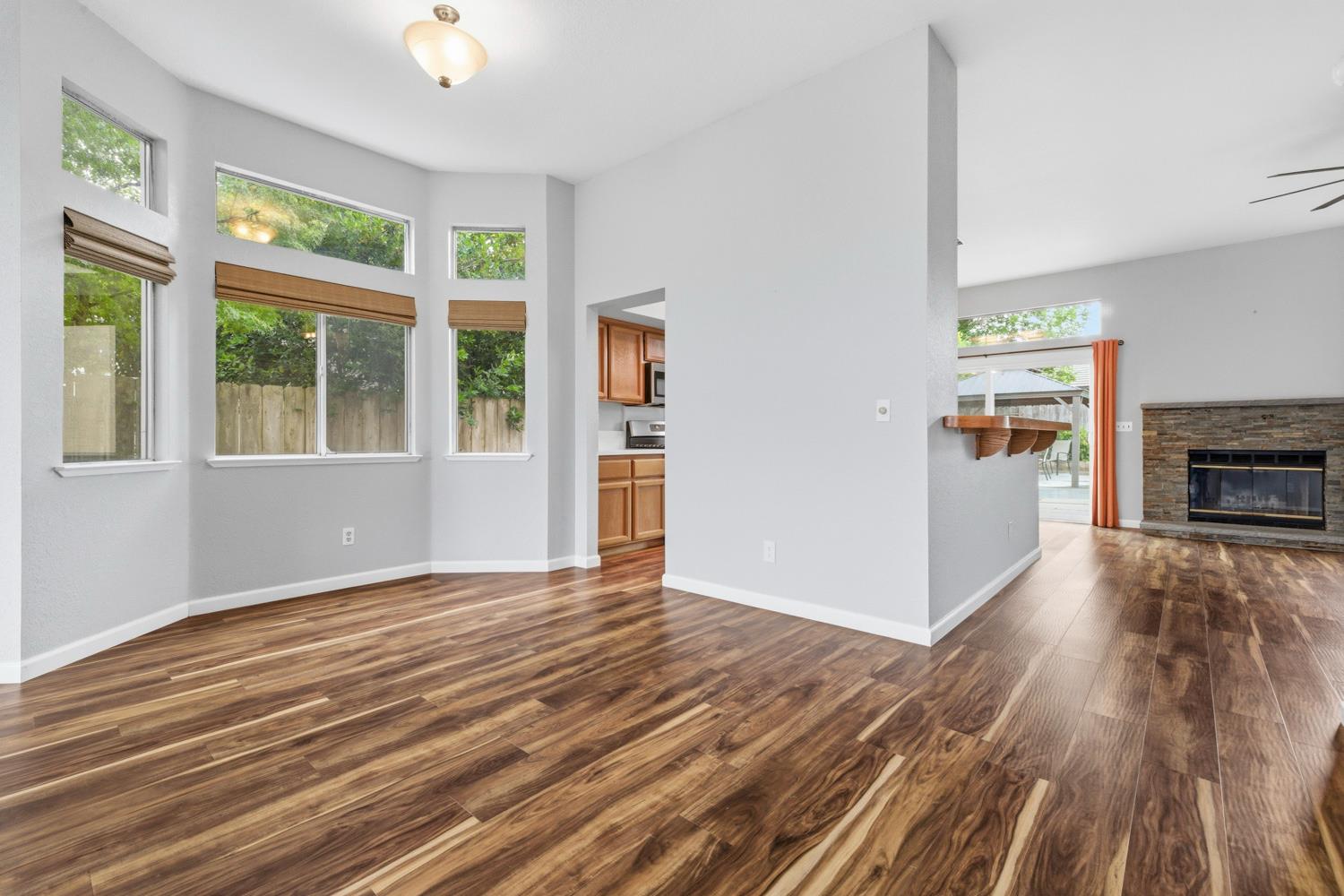 969 Colson Way Galt, CA 95632 - Photo 10 of 38 a view of an empty room with a window and wooden floor