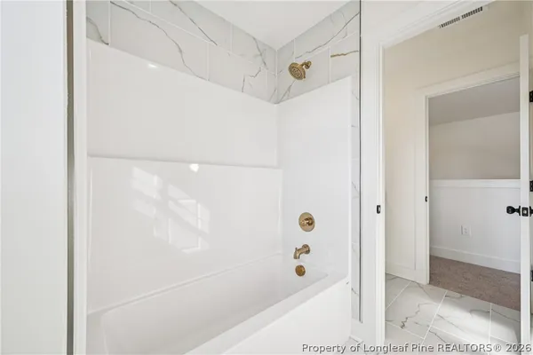 a view of swimming pool with a table and chairs