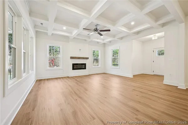a kitchen with kitchen island a white counter top space cabinets and stainless steel appliances