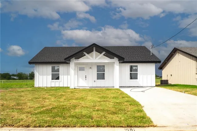 a front view of a house with yard