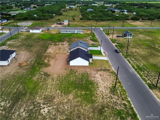 a view of a lake with a yard