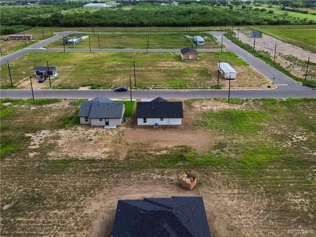 a view of a lake with a yard
