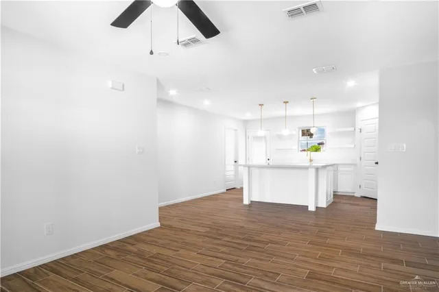 a view of kitchen with wooden floor