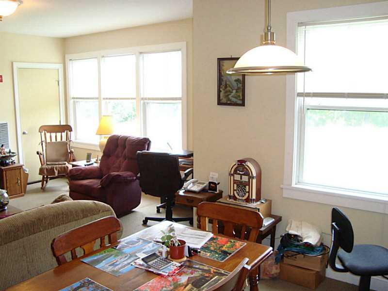 200 Clarke Road, Unit 108 Narragansett, RI 02882 - Photo 4 of 9 Living Room. Open living/kitchen/dining with six west facing windows