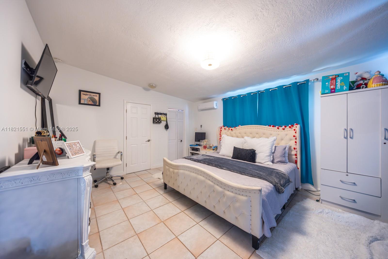 780 95th Street Marathon, FL 33050 - Photo 16 of 31 a bed room with a bed and a dresser