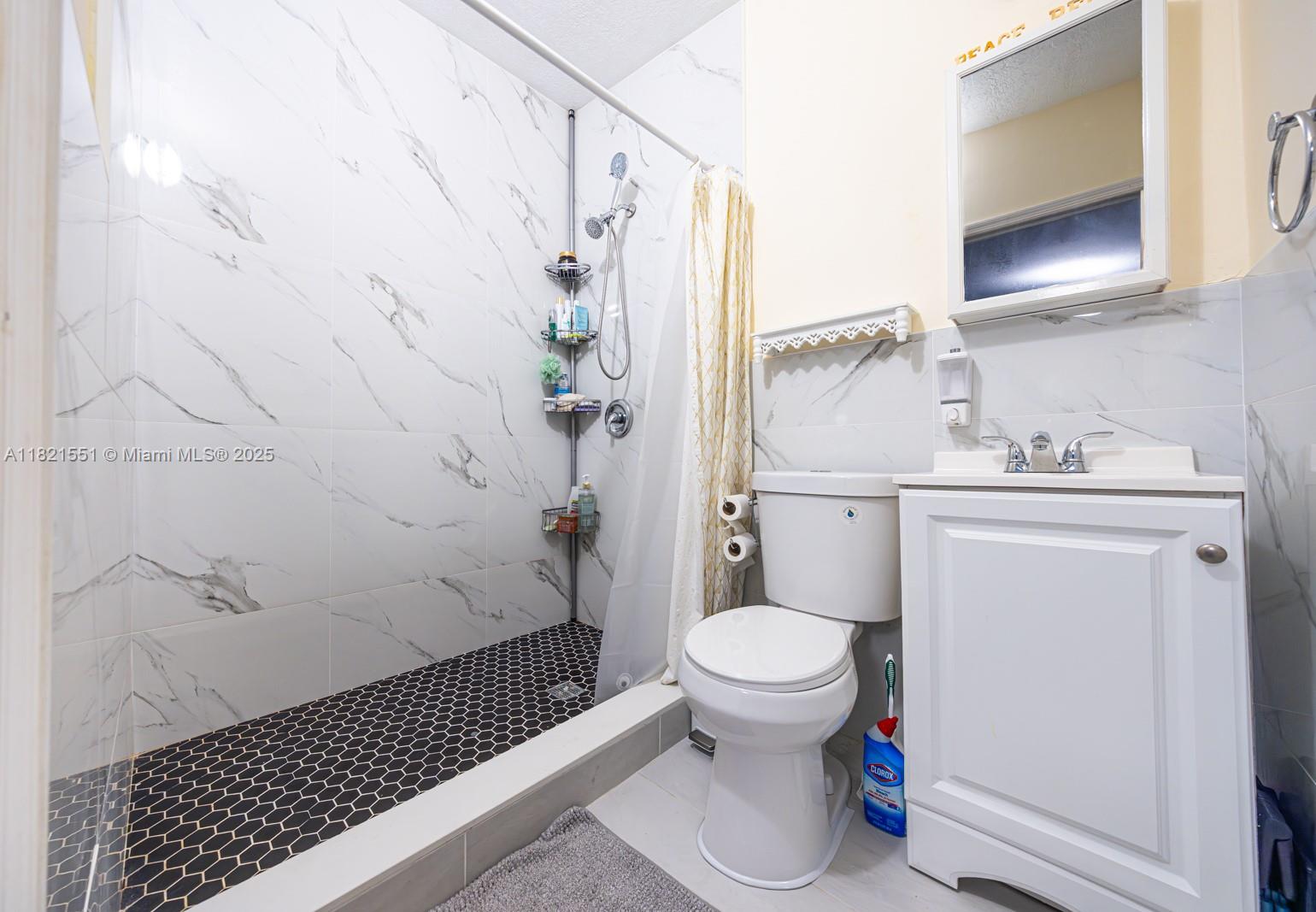 780 95th Street Marathon, FL 33050 - Photo 18 of 31 a bathroom with a sink toilet and shower