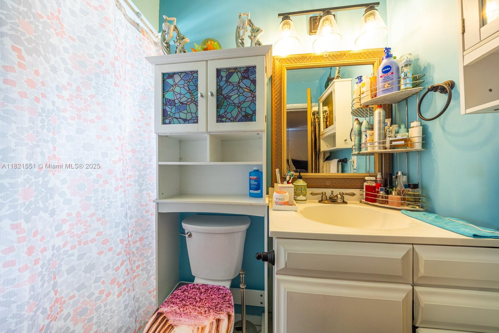 780 95th Street Marathon, FL 33050 - Photo 24 of 31 a bathroom with a sink and a mirror
