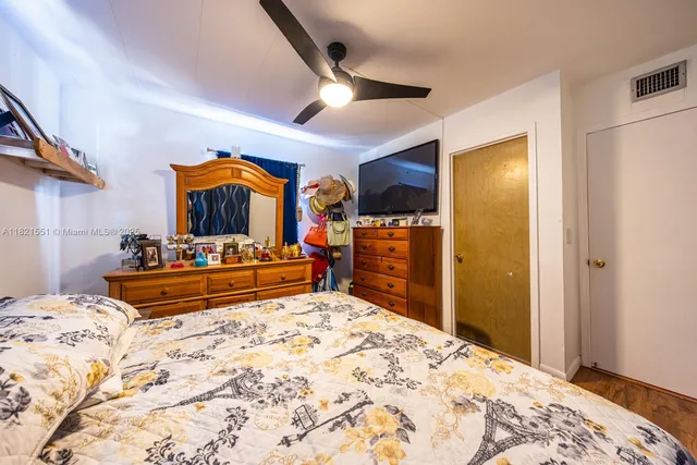 a bed room with a bed and a walk in closet