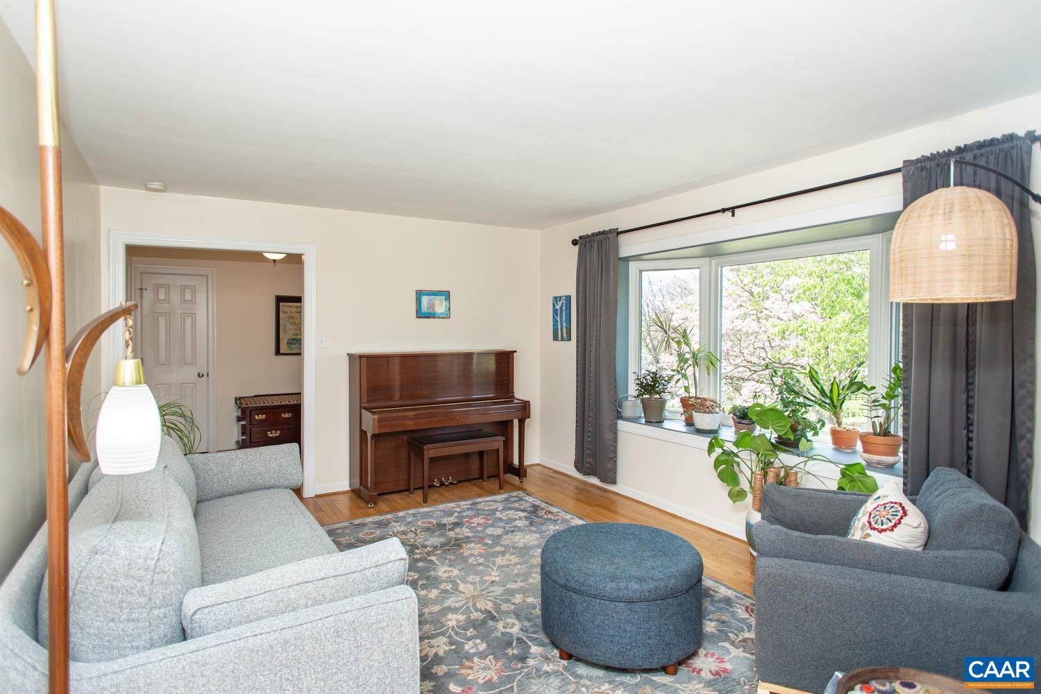 2750 Meriwether Drive Charlottesville, VA 22901 - Photo 11 of 52 a living room with furniture and a fireplace