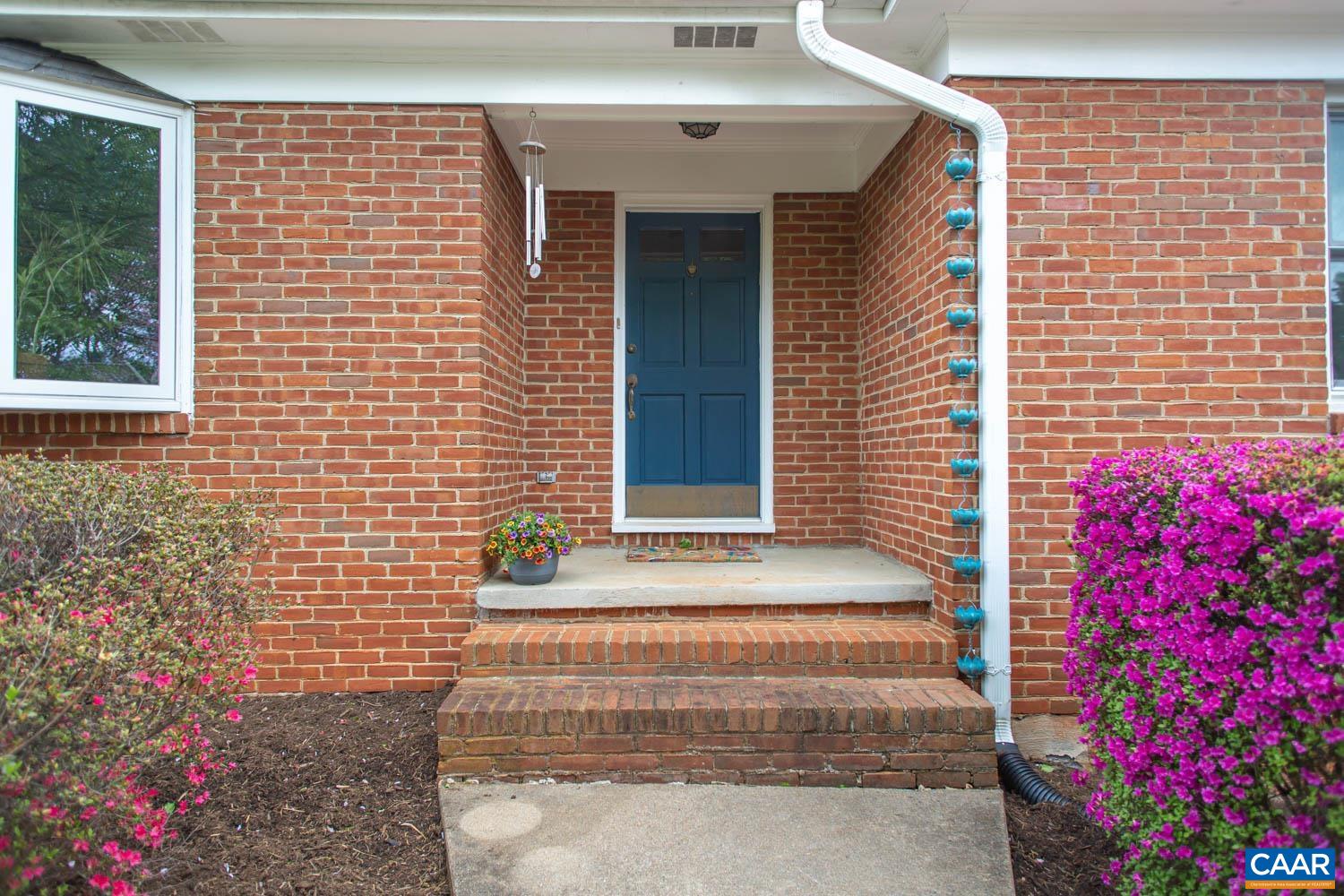 2750 Meriwether Drive Charlottesville, VA 22901 - Photo 2 of 52 a front view of a house with a garden