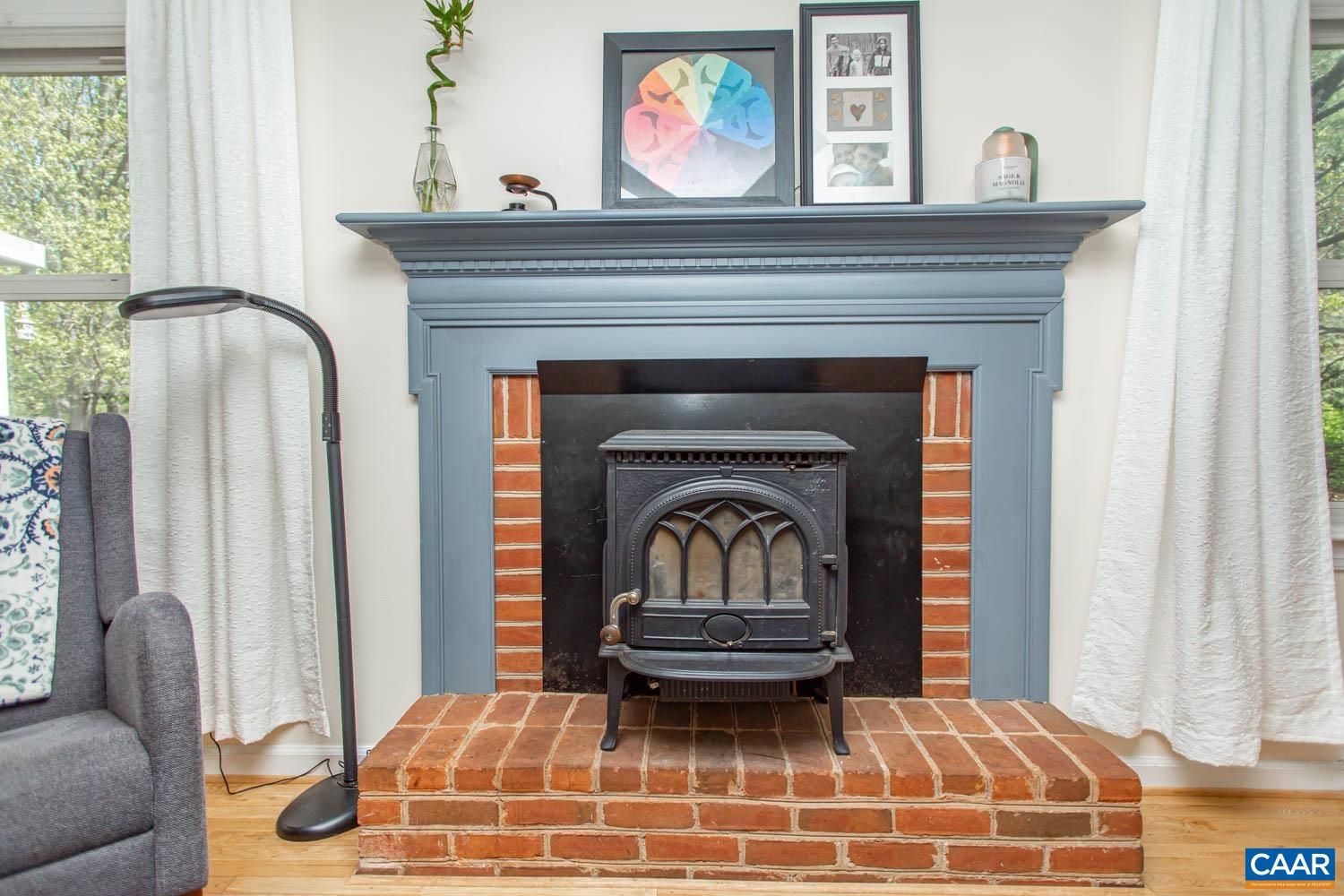 2750 Meriwether Drive Charlottesville, VA 22901 - Photo 22 of 52 a living room with a fireplace and a window