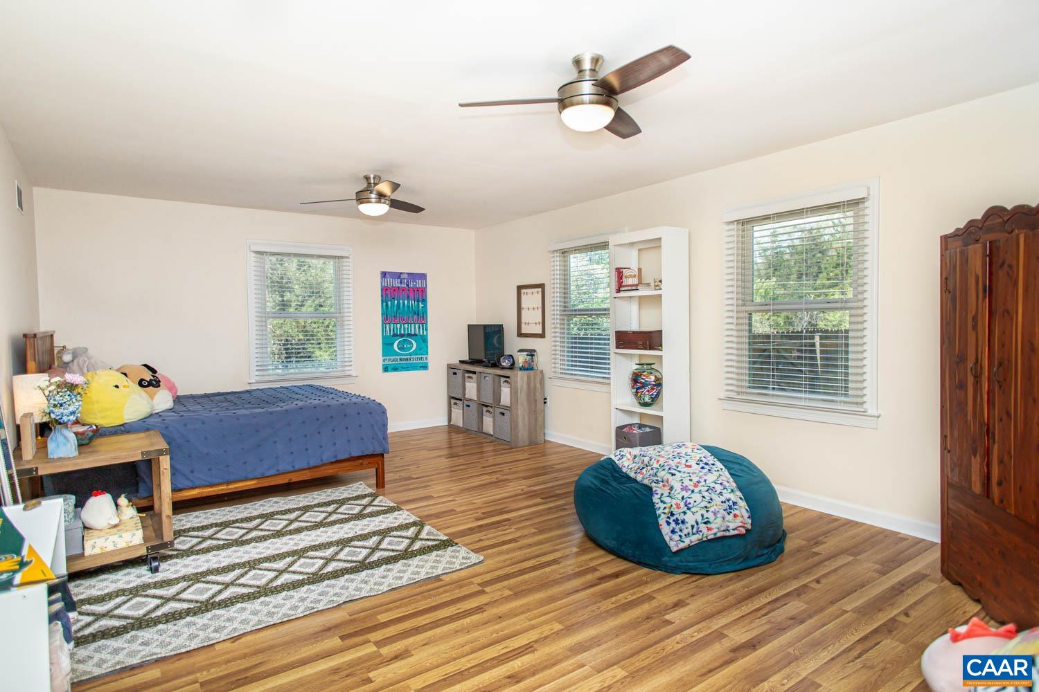 2750 Meriwether Drive Charlottesville, VA 22901 - Photo 23 of 52 a living room with furniture and a wooden floor