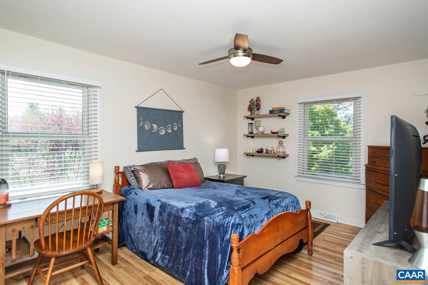 2750 Meriwether Drive Charlottesville, VA 22901 - Photo 26 of 52 a bedroom with a bed and a flat screen tv