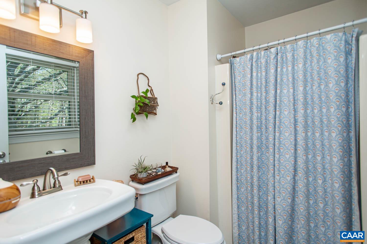 2750 Meriwether Drive Charlottesville, VA 22901 - Photo 28 of 52 a bathroom with a sink toilet and mirror