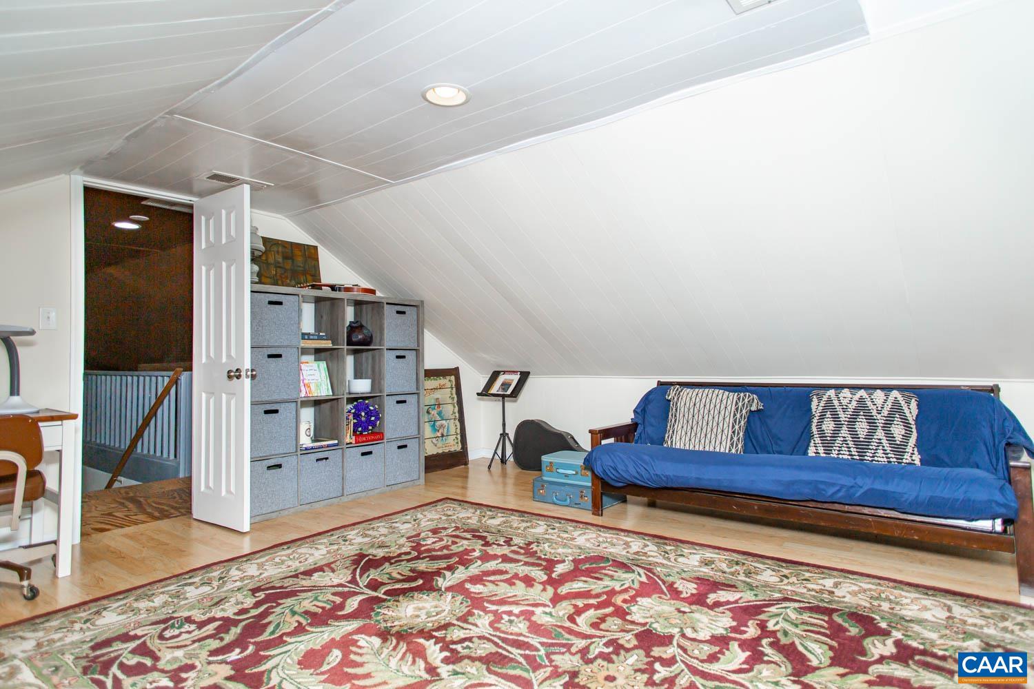 2750 Meriwether Drive Charlottesville, VA 22901 - Photo 34 of 52 a living room with furniture and a rug