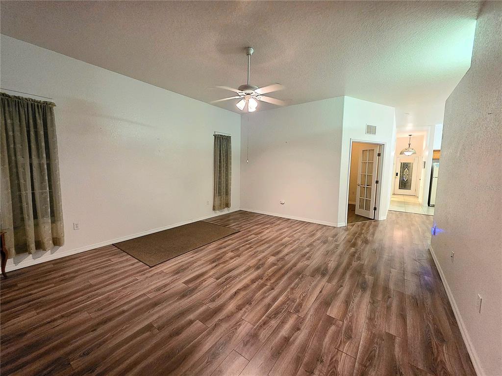2116 Northeast 40th Terrace Ocala, FL 34470 - Photo 16 of 37 a view of empty room with wooden floor