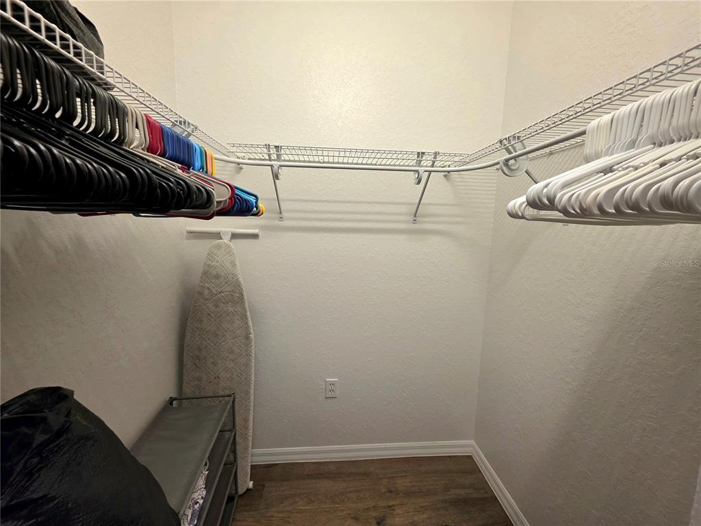 2116 Northeast 40th Terrace Ocala, FL 34470 - Photo 26 of 37 a view of walk in closet with clothes and shoes