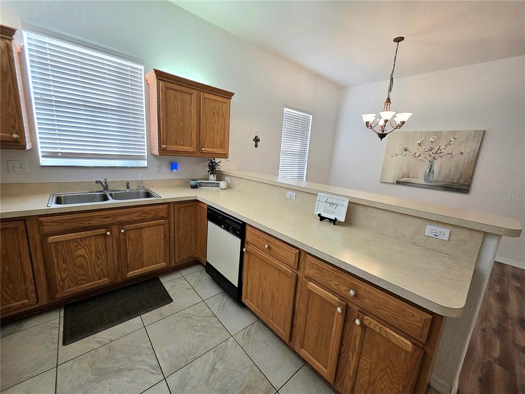2116 Northeast 40th Terrace Ocala, FL 34470 - Photo 7 of 37 a kitchen with a sink and cabinets
