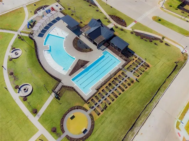 a view of a house with a yard and garage