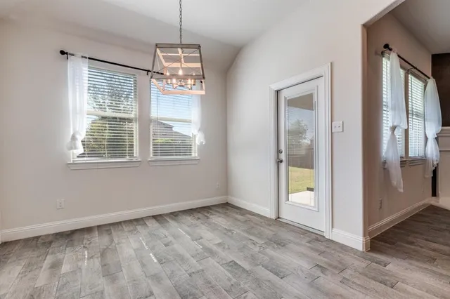 a view of a swimming pool with lounge chairs