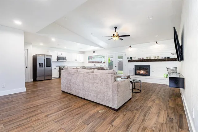 a view of a dining room with furniture and wooden floor