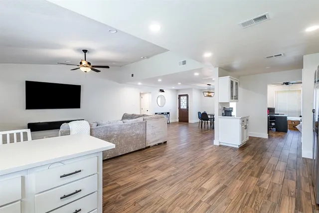 a view of a patio with table and chairs and potted plants