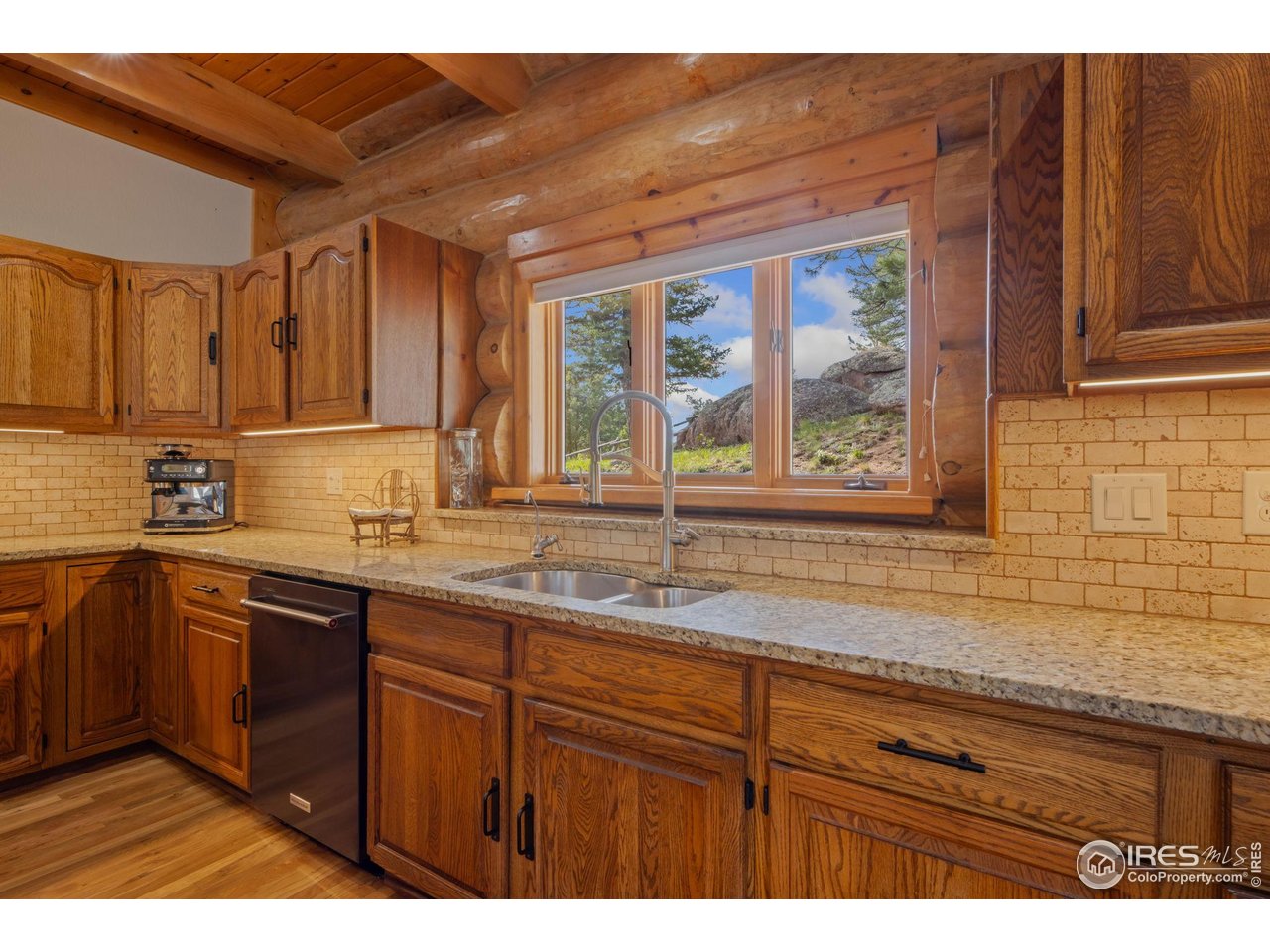 95 Choctaw Road Lyons, CO 80540 - Photo 13 of 40 a kitchen with a sink and cabinets