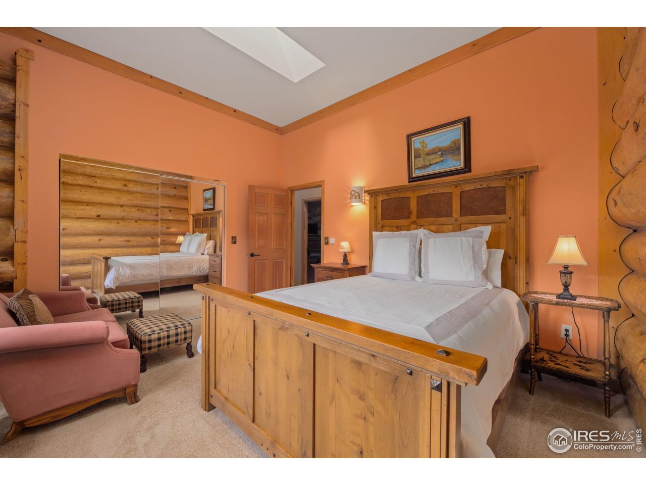 95 Choctaw Road Lyons, CO 80540 - Photo 22 of 40 a bedroom with a bed and a cabinets