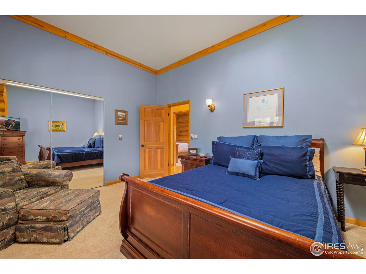 95 Choctaw Road Lyons, CO 80540 - Photo 24 of 40 a living room with furniture a flat screen tv and a dresser