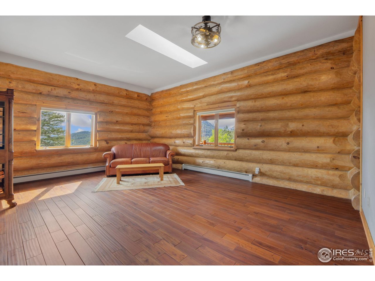 95 Choctaw Road Lyons, CO 80540 - Photo 28 of 40 a view of room with wooden floor and chair