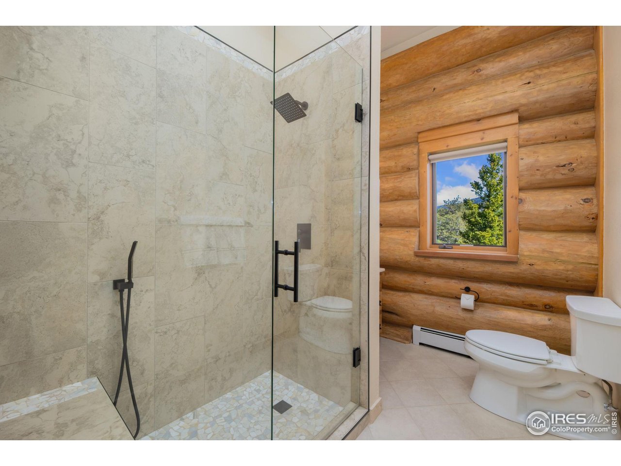 95 Choctaw Road Lyons, CO 80540 - Photo 29 of 40 a bathroom with a toilet and a shower
