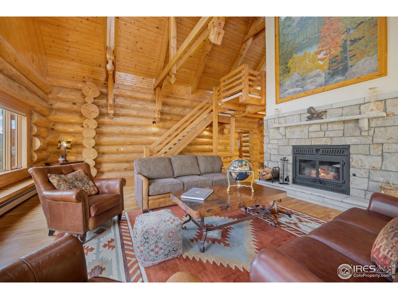 95 Choctaw Road Lyons, CO 80540 - Photo 9 of 40 a living room with furniture and a fireplace