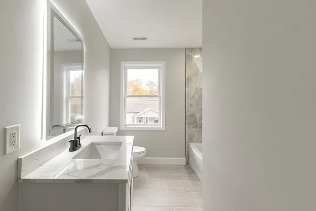 a bathroom with a sink and a tub
