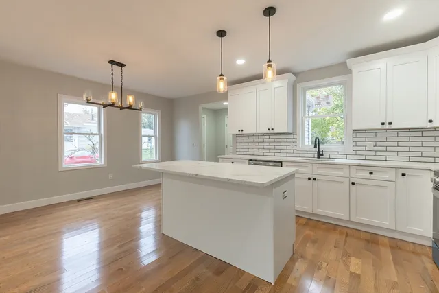 a kitchen with sink cabinets and window