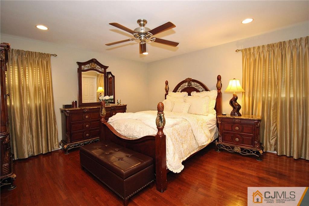 5 Delmar Place Edison, NJ 08837 - Photo 15 of 25 a bedroom with a bed window and a mirror