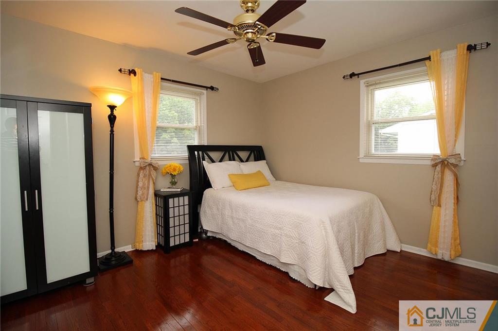 5 Delmar Place Edison, NJ 08837 - Photo 17 of 25 a bedroom with a bed and wooden floor