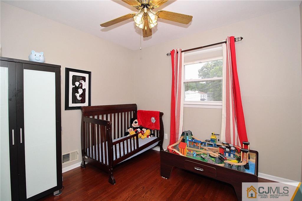 5 Delmar Place Edison, NJ 08837 - Photo 18 of 25 a bedroom with furniture and a window