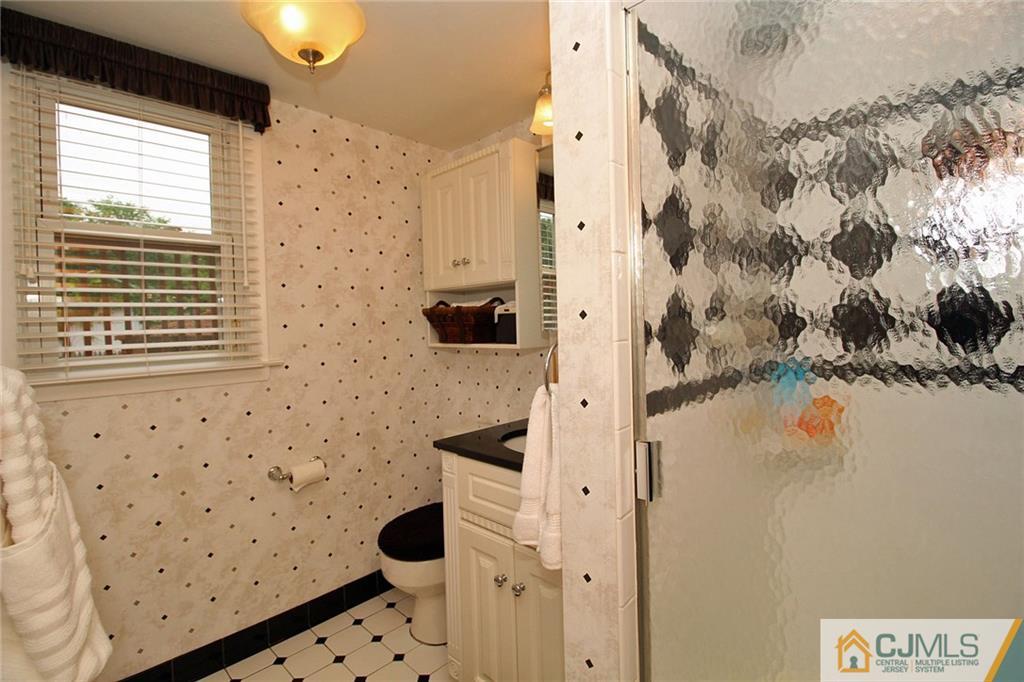 5 Delmar Place Edison, NJ 08837 - Photo 22 of 25 a bathroom with a shower toilet and sink