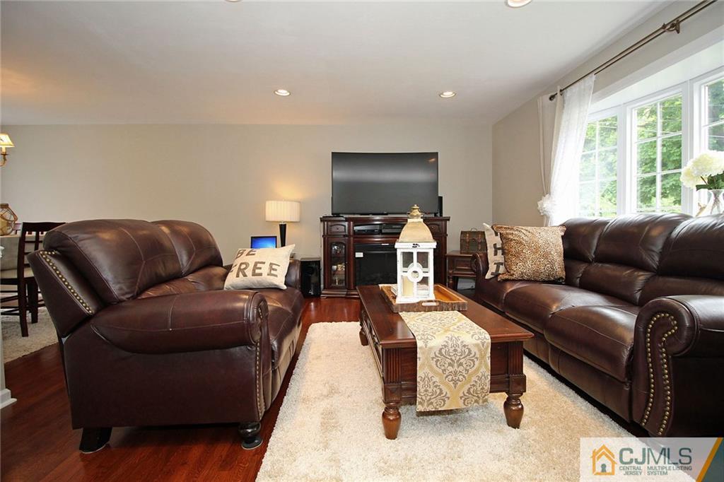 5 Delmar Place Edison, NJ 08837 - Photo 6 of 25 a living room with furniture and a flat screen tv