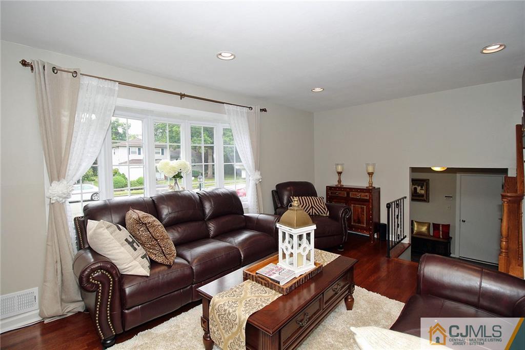 5 Delmar Place Edison, NJ 08837 - Photo 7 of 25 a living room with furniture and a large window
