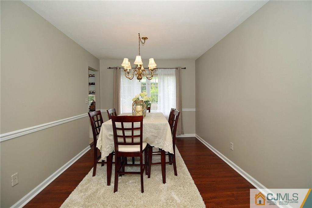 5 Delmar Place Edison, NJ 08837 - Photo 9 of 25 a view of a dining room with furniture and chandelier