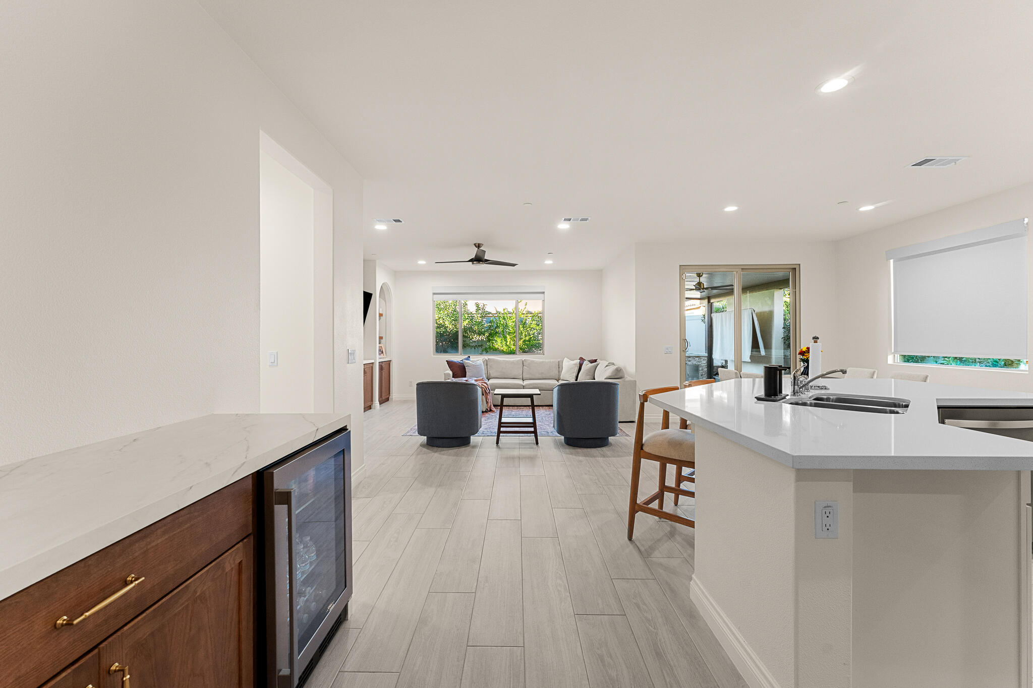 84458 Calle Larriva Coachella, CA 92236 - Photo 11 of 43 a kitchen with a sink a counter top space and living room area