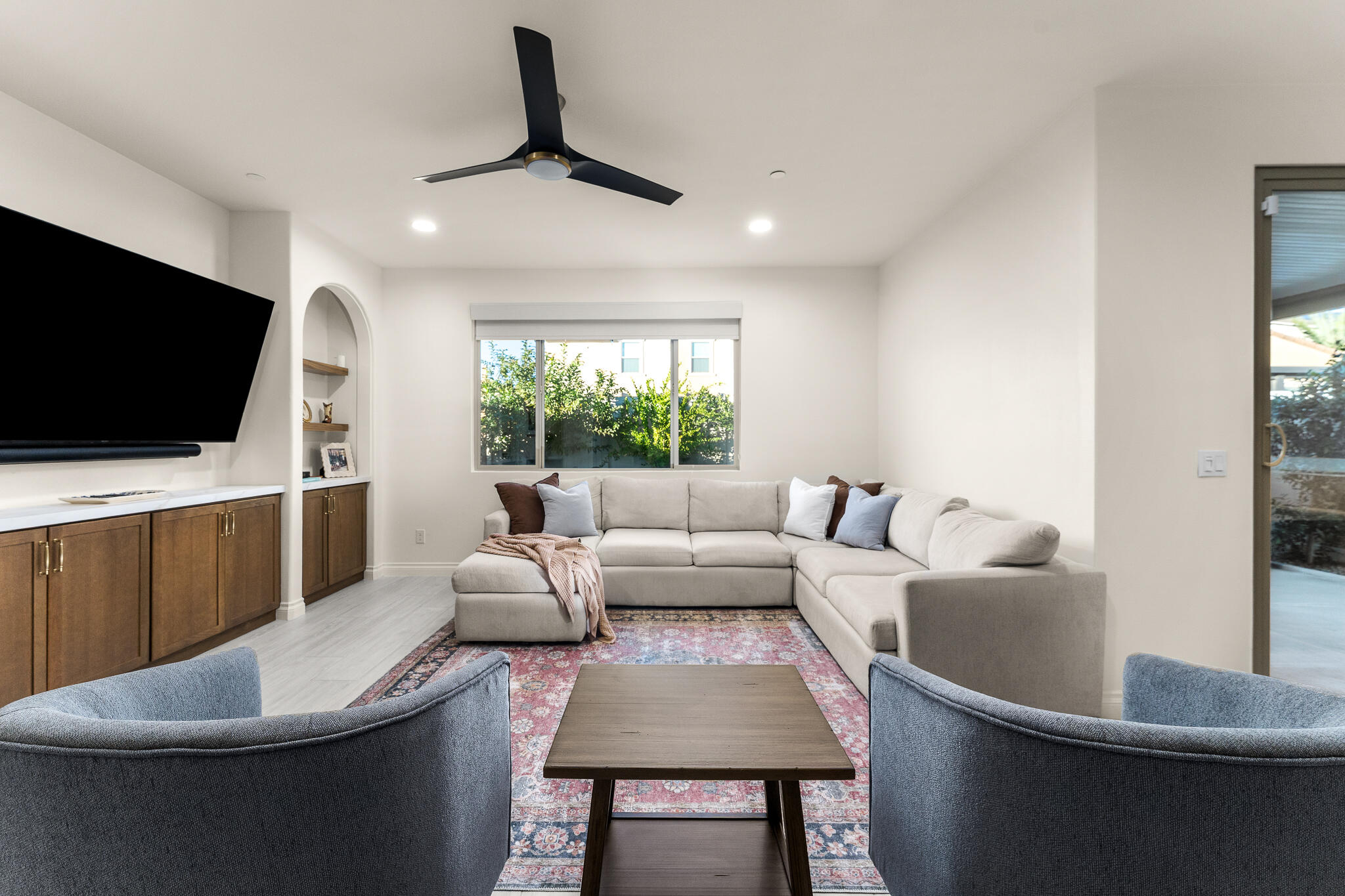 84458 Calle Larriva Coachella, CA 92236 - Photo 12 of 43 a living room with furniture and a flat screen tv