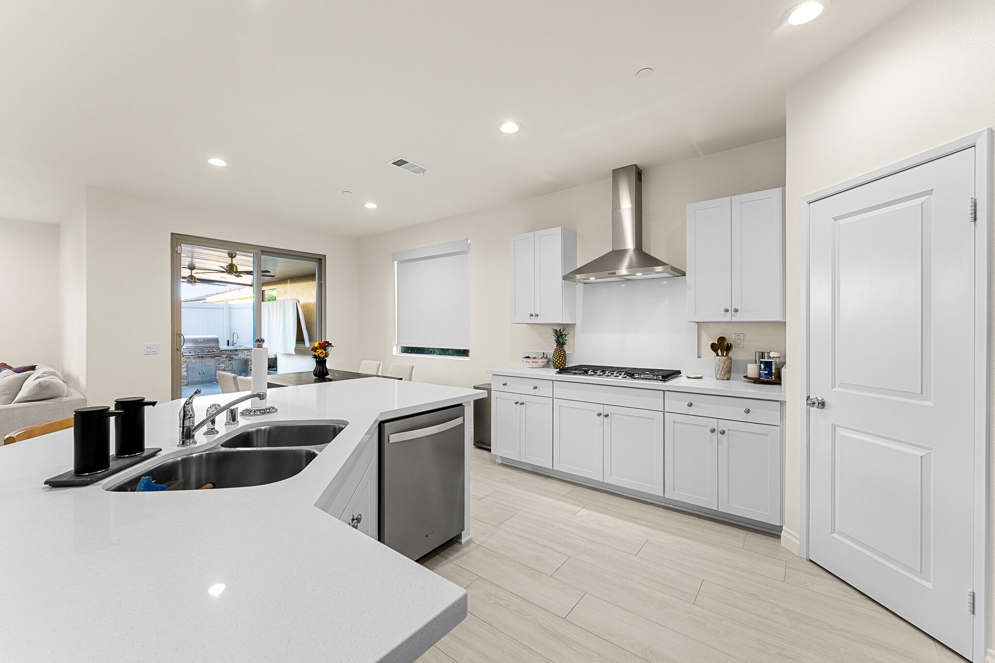84458 Calle Larriva Coachella, CA 92236 - Photo 16 of 43 a kitchen with stainless steel appliances a sink stove and cabinets