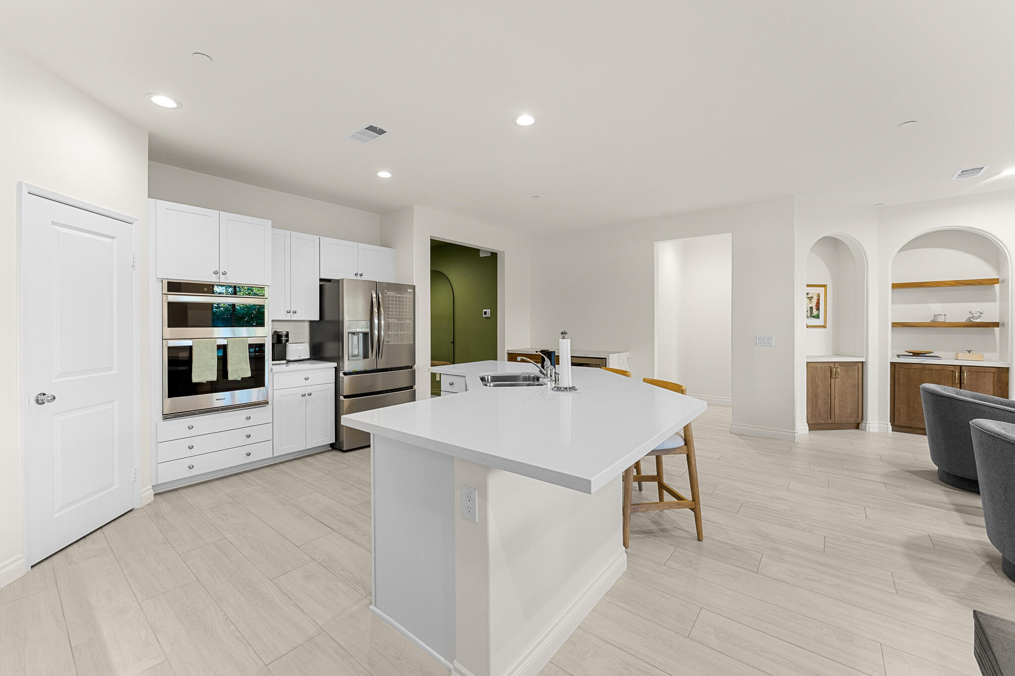 84458 Calle Larriva Coachella, CA 92236 - Photo 17 of 43 a large kitchen with kitchen island a sink table and chairs