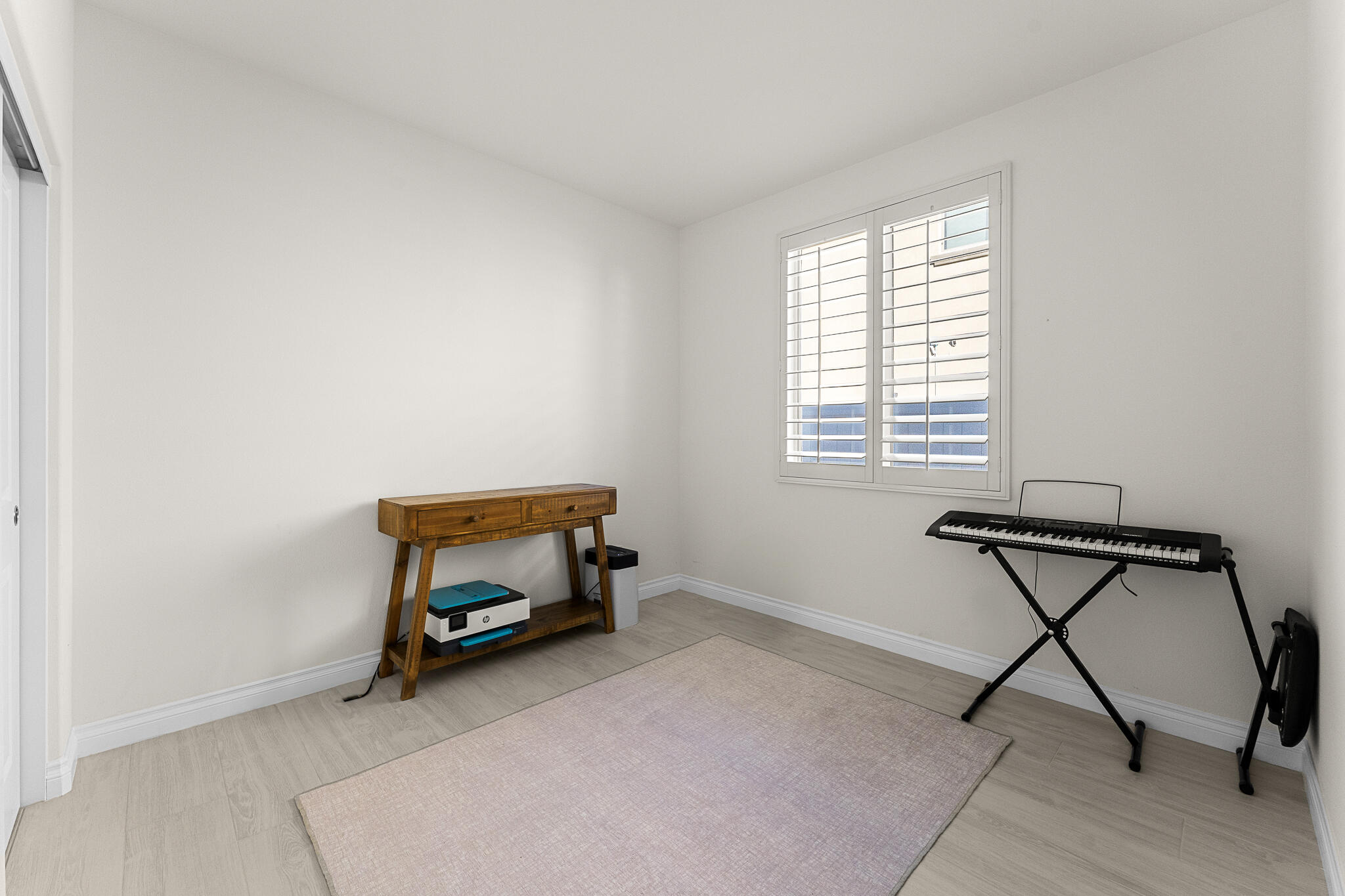 84458 Calle Larriva Coachella, CA 92236 - Photo 27 of 43 a room with a window and a table